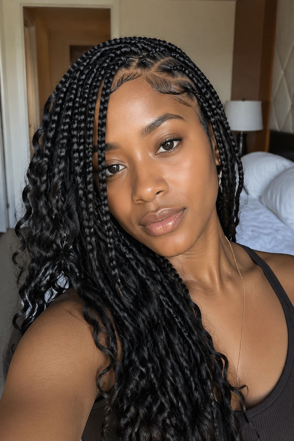 Close-up of side-part boho box braids framing the face on a real person
