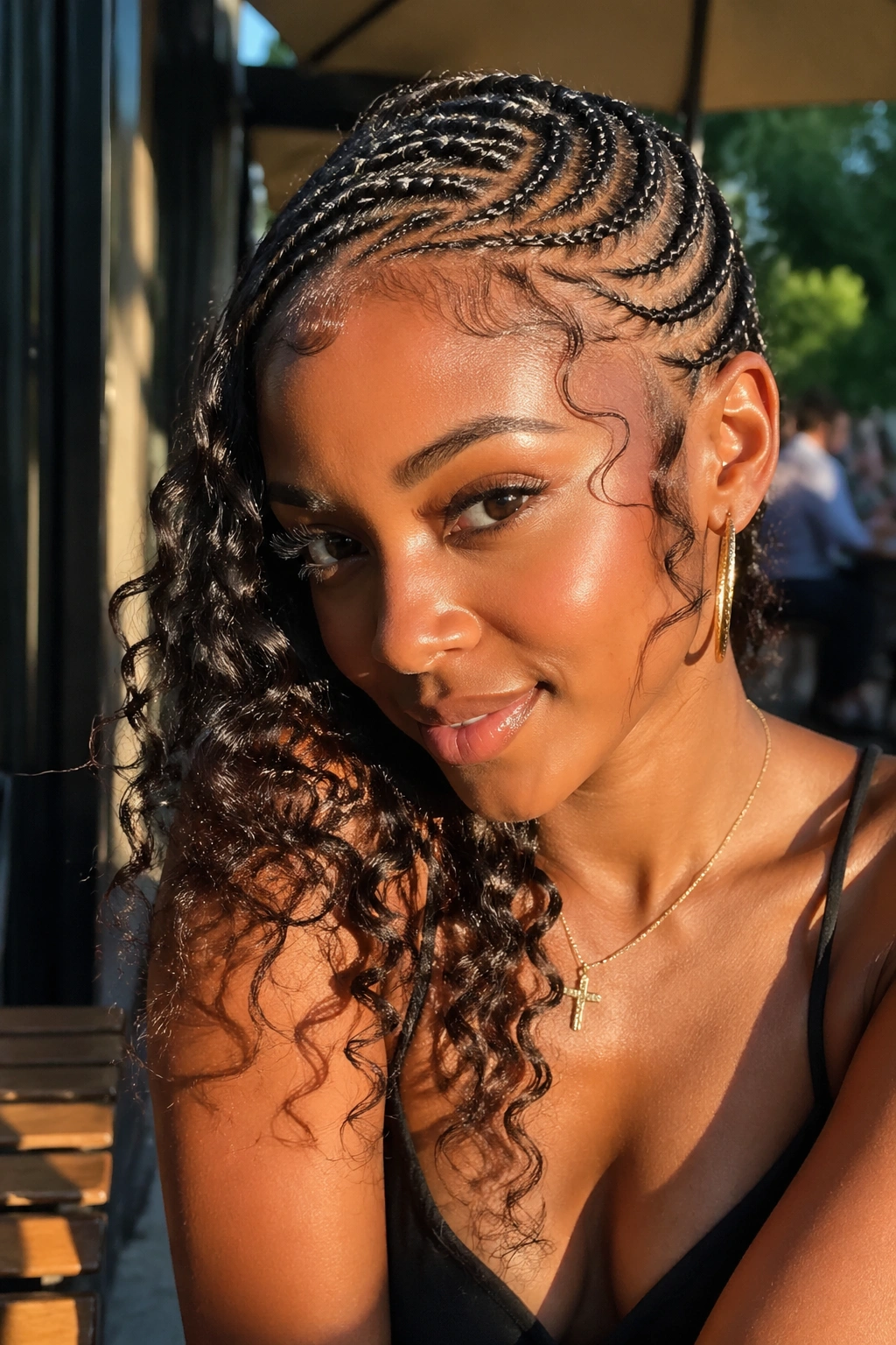Close-up of side-swept butterfly cornrows with curls on one side.