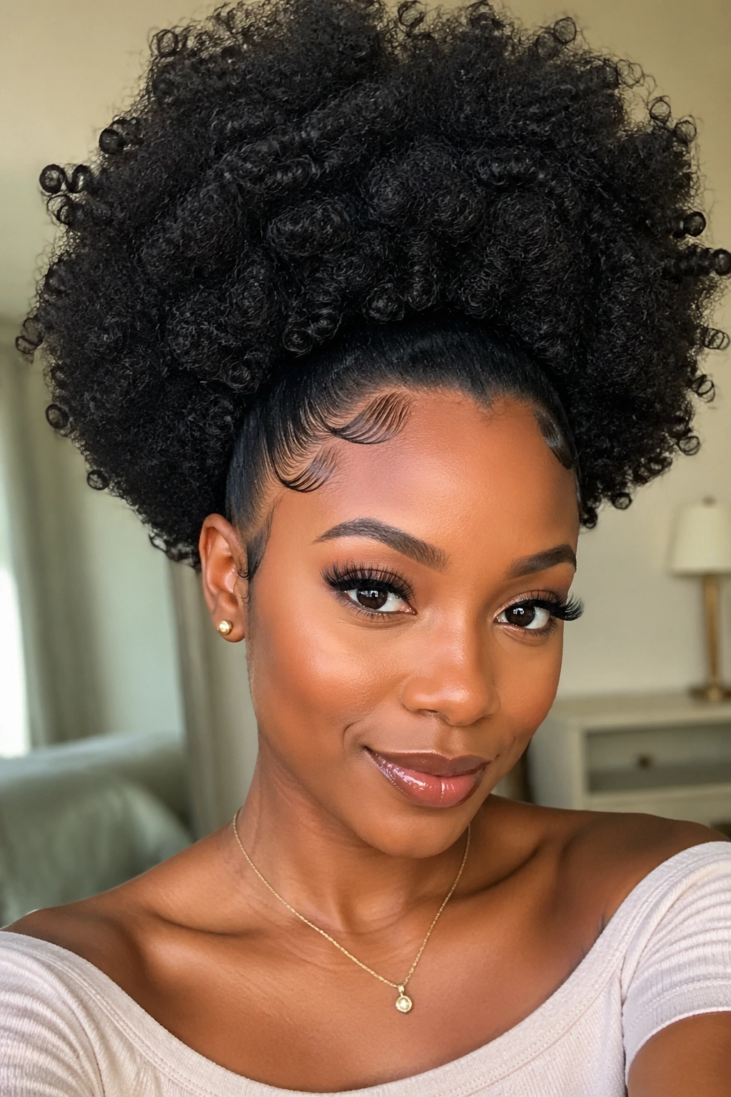Close-up of a real woman with sleek front edges blending into a voluminous afro