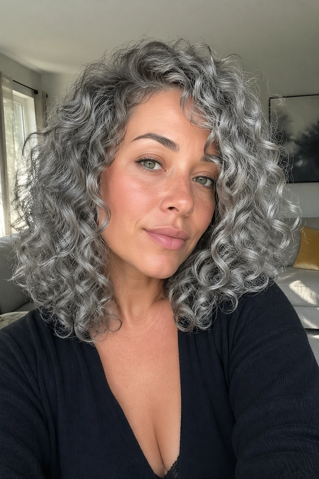 Close-up of real person with smoky silver curls in natural daylight