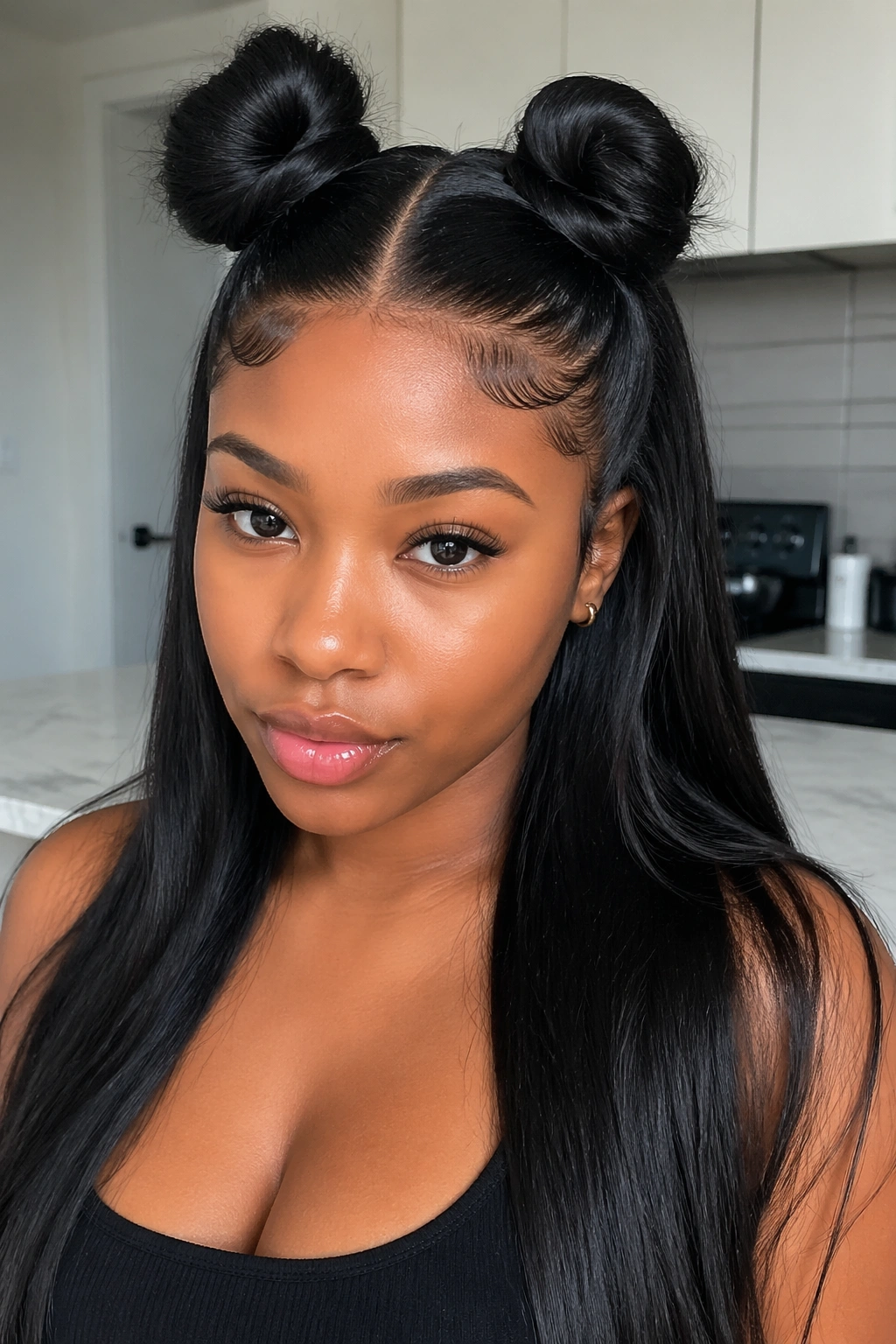 Woman with half up half down quick weave and space buns.