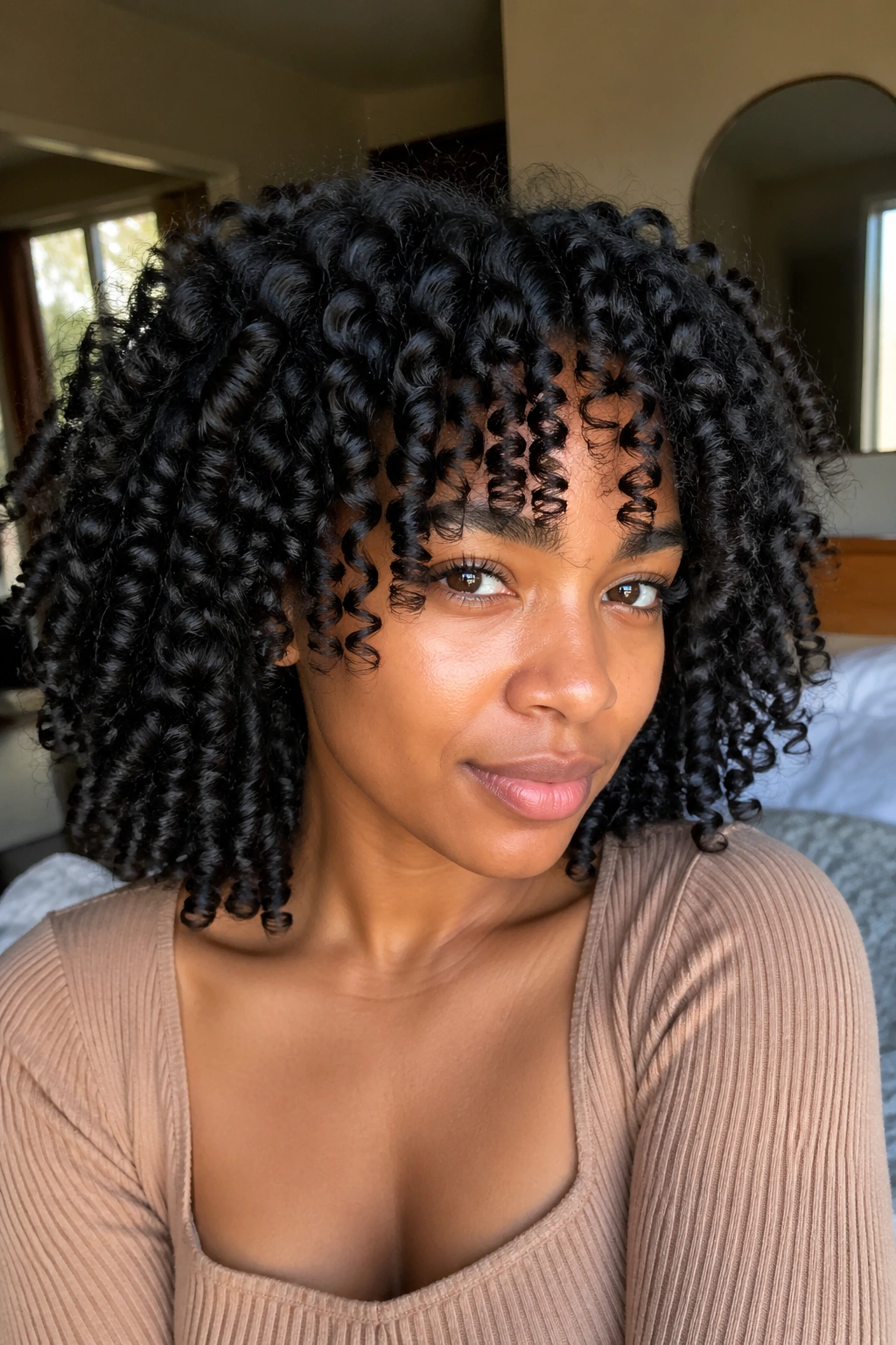 Close-up of a real woman with straw curls on natural hair