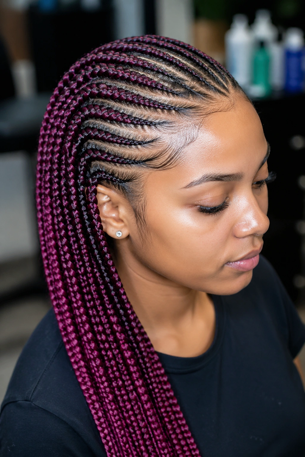 Real person wearing cornrows with synthetic color extensions.