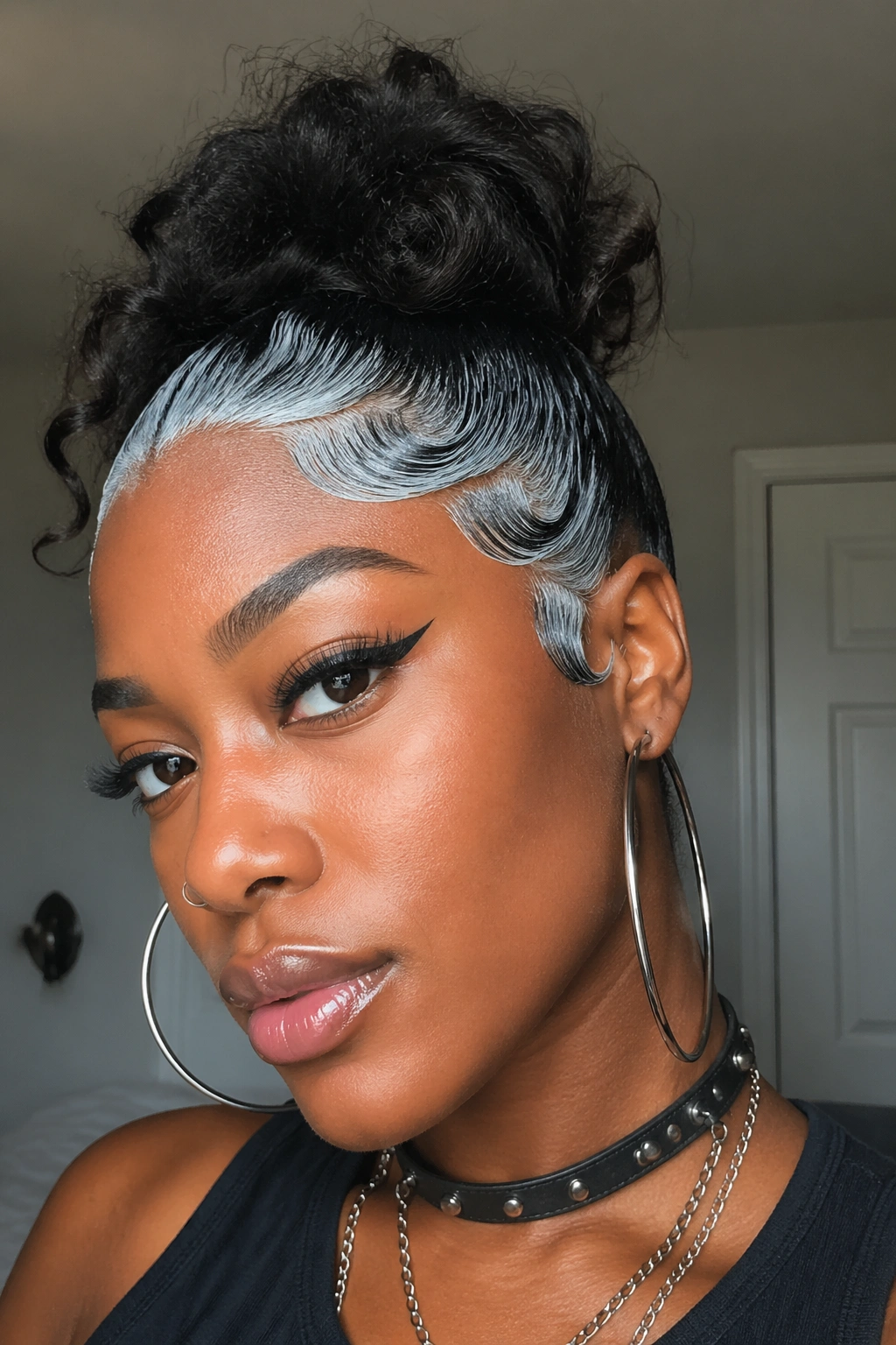 Close-up of tinted silver edges along a black hairline