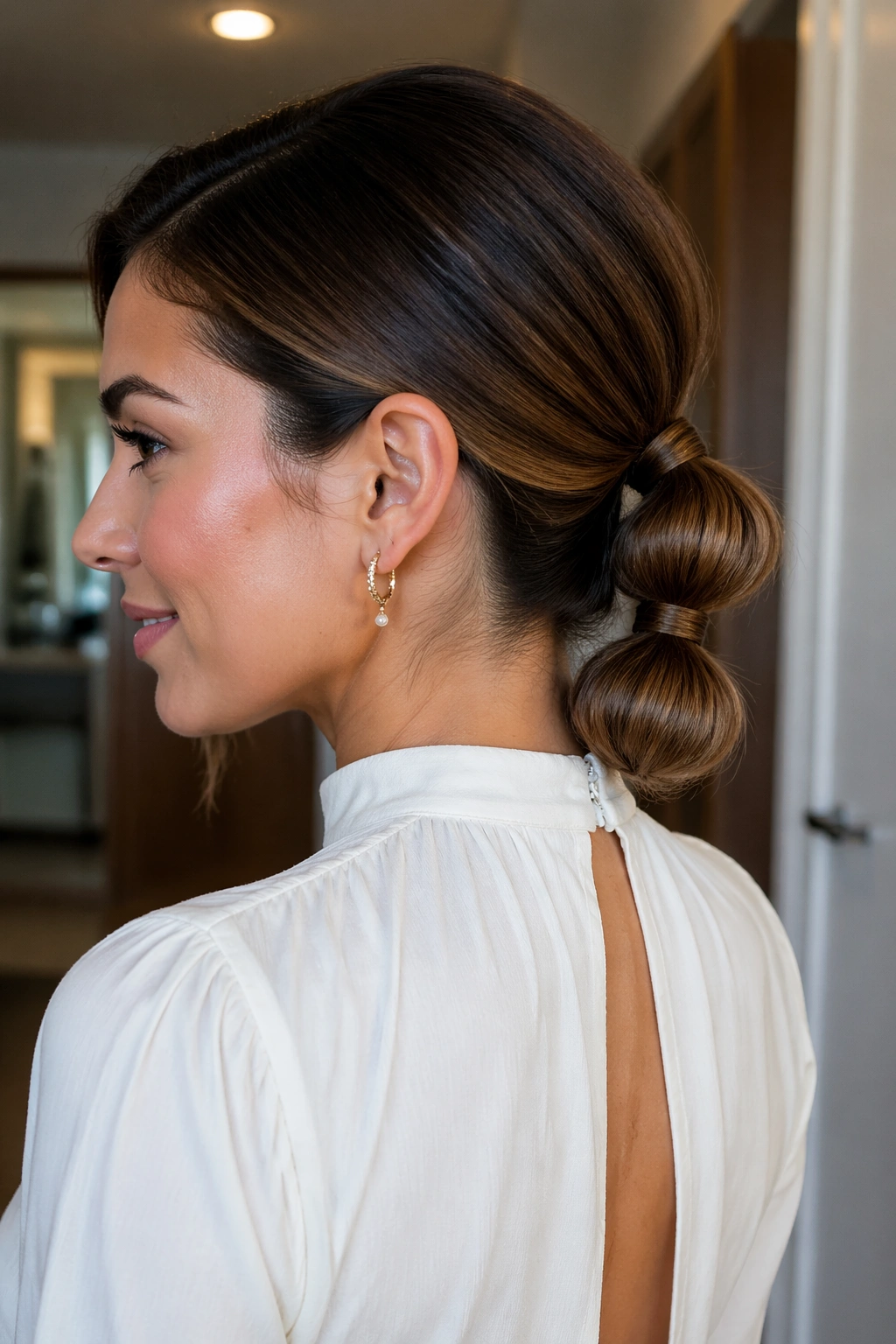 Real woman with tucked-end bubble ponytail under the final bubble