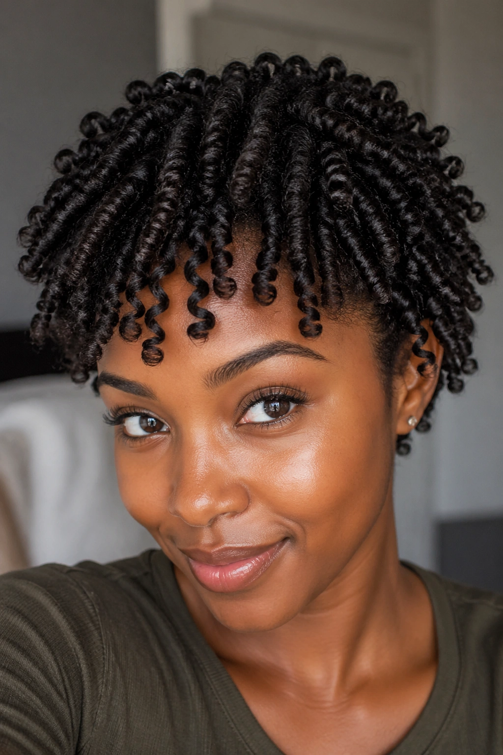 Portrait of a real person with a twist-out on damp hair.