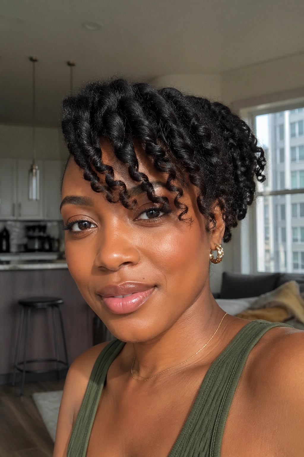 Close-up of a person with twist-out side bang and flowing waves