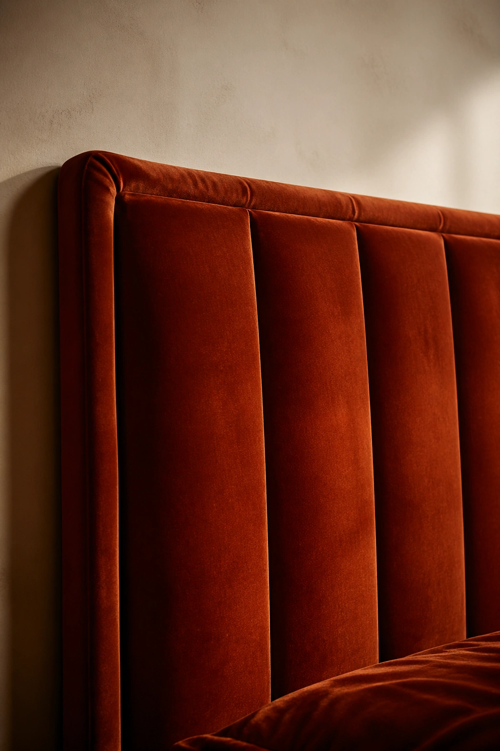 Rust velvet headboard with warm lighting