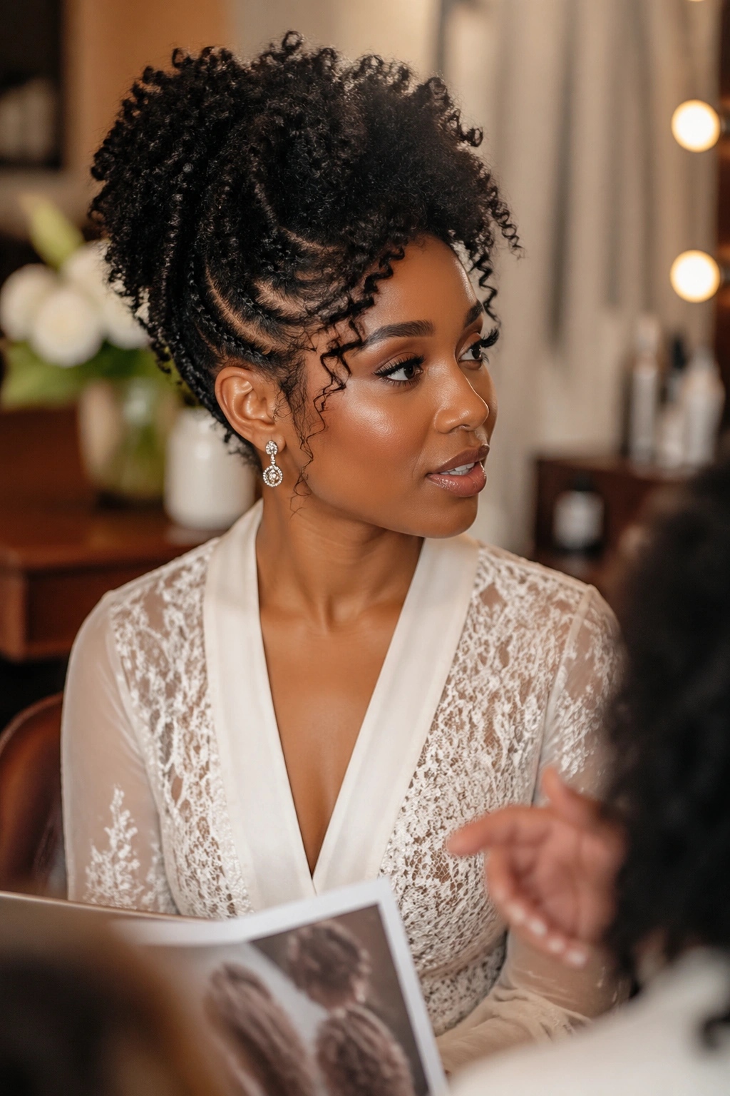 Bride discussing wedding updo vision in salon