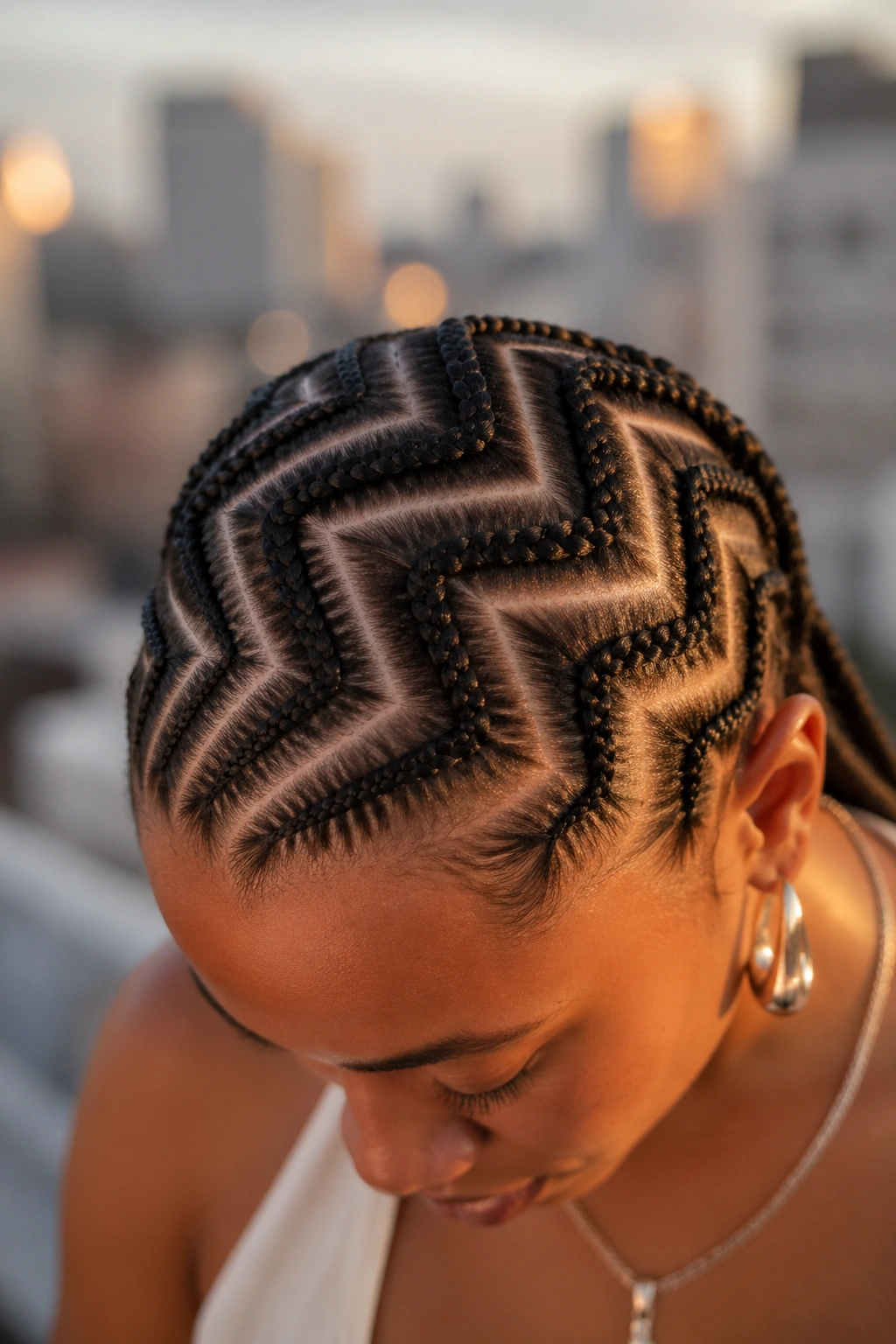 Wide zigzag cornrows with large angle changes exposing scalp on real person