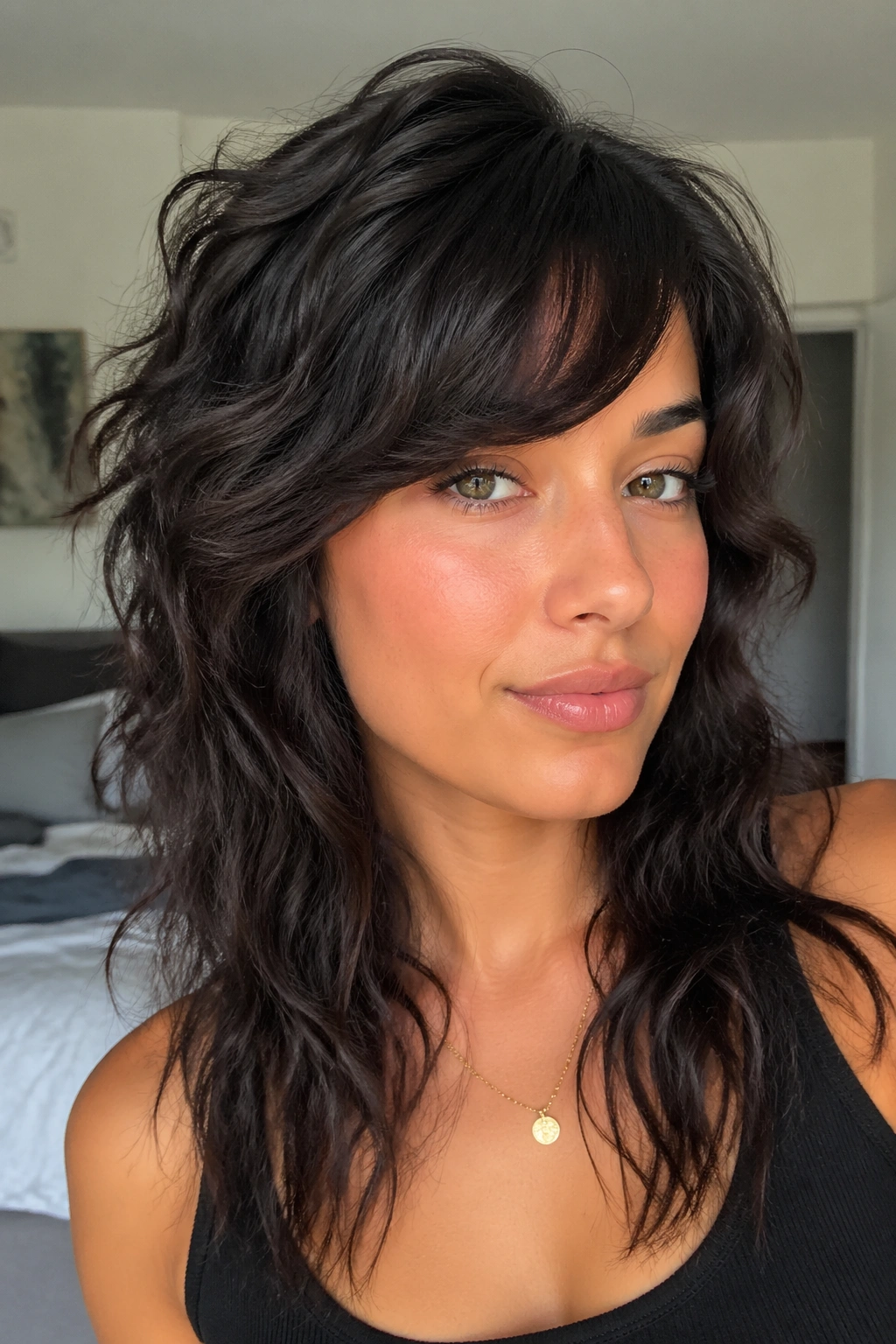 Close-up of a real woman with wolf cut side bangs in soft daylight