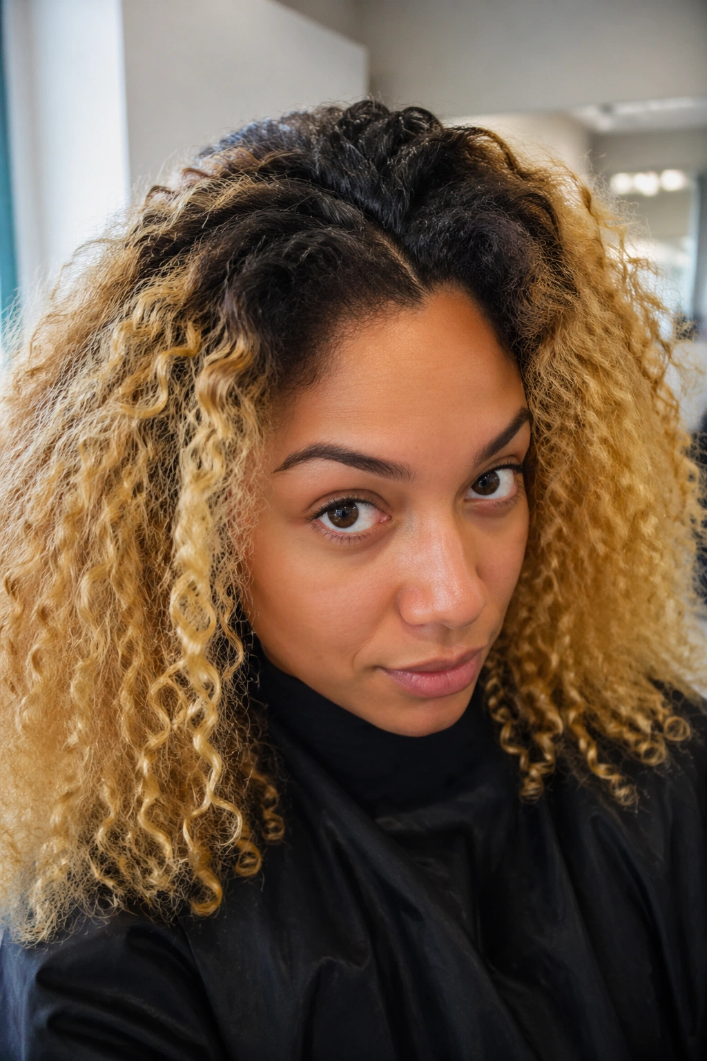 Close-up of a real person showing hair lift from roots to mid-lengths.