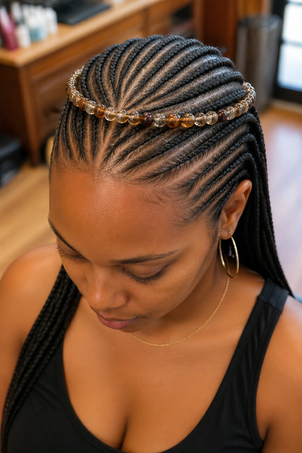 Beaded crown detail on twenty small cornrows