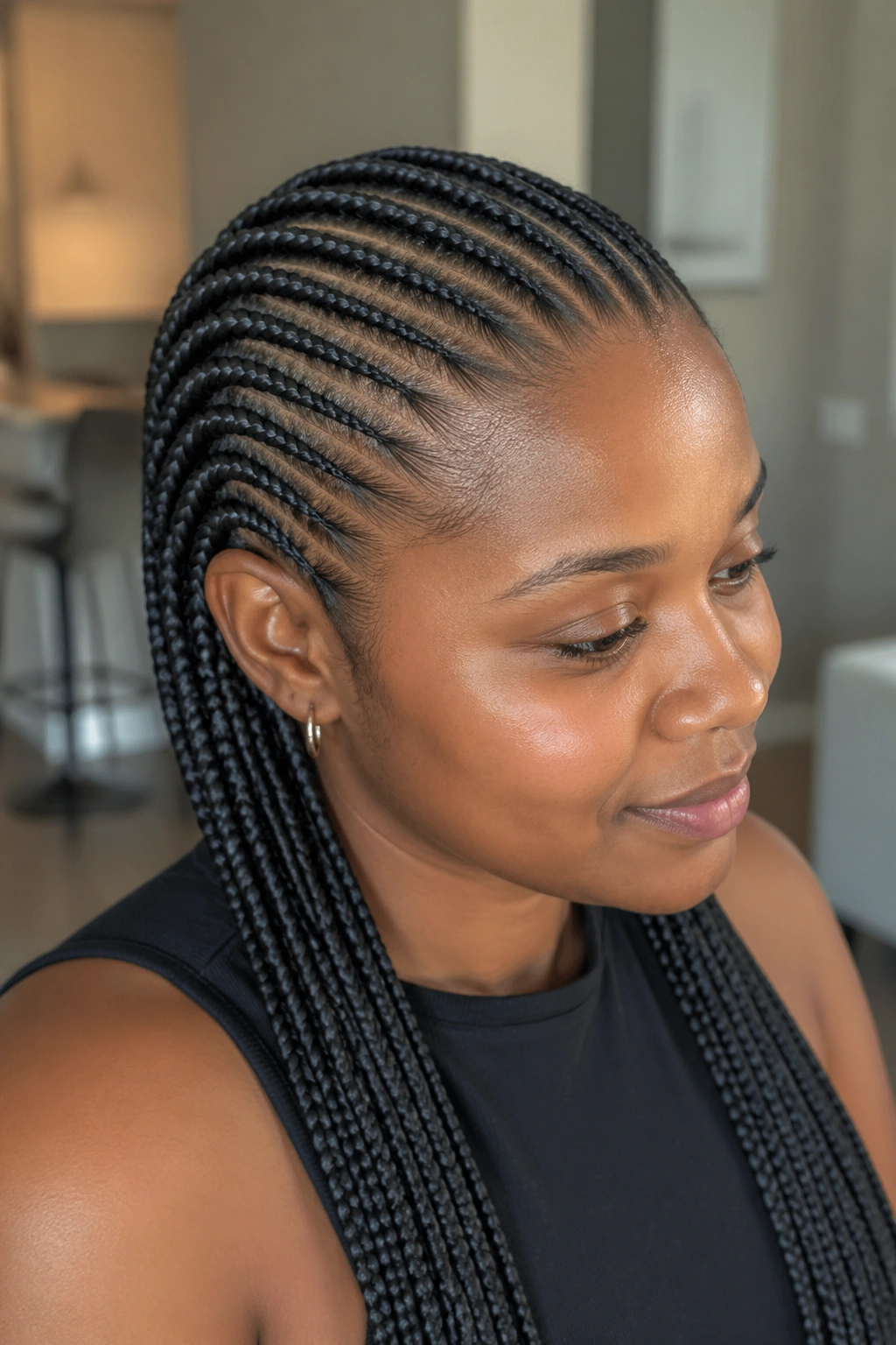 Close-up of small back cornrows with kanekalon feed-in length on a real person.