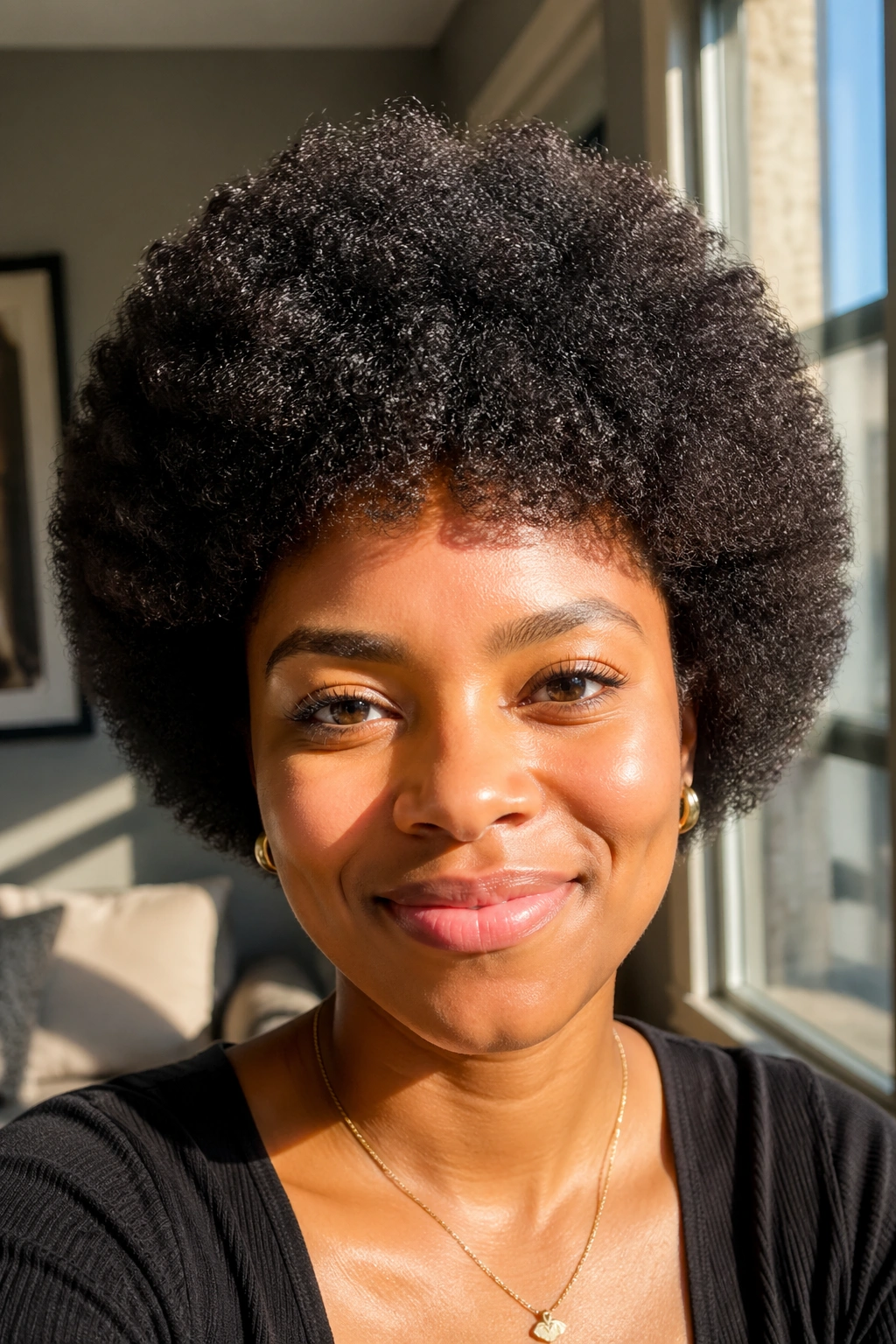 Real person with a perfectly rounded mini afro fully picked out