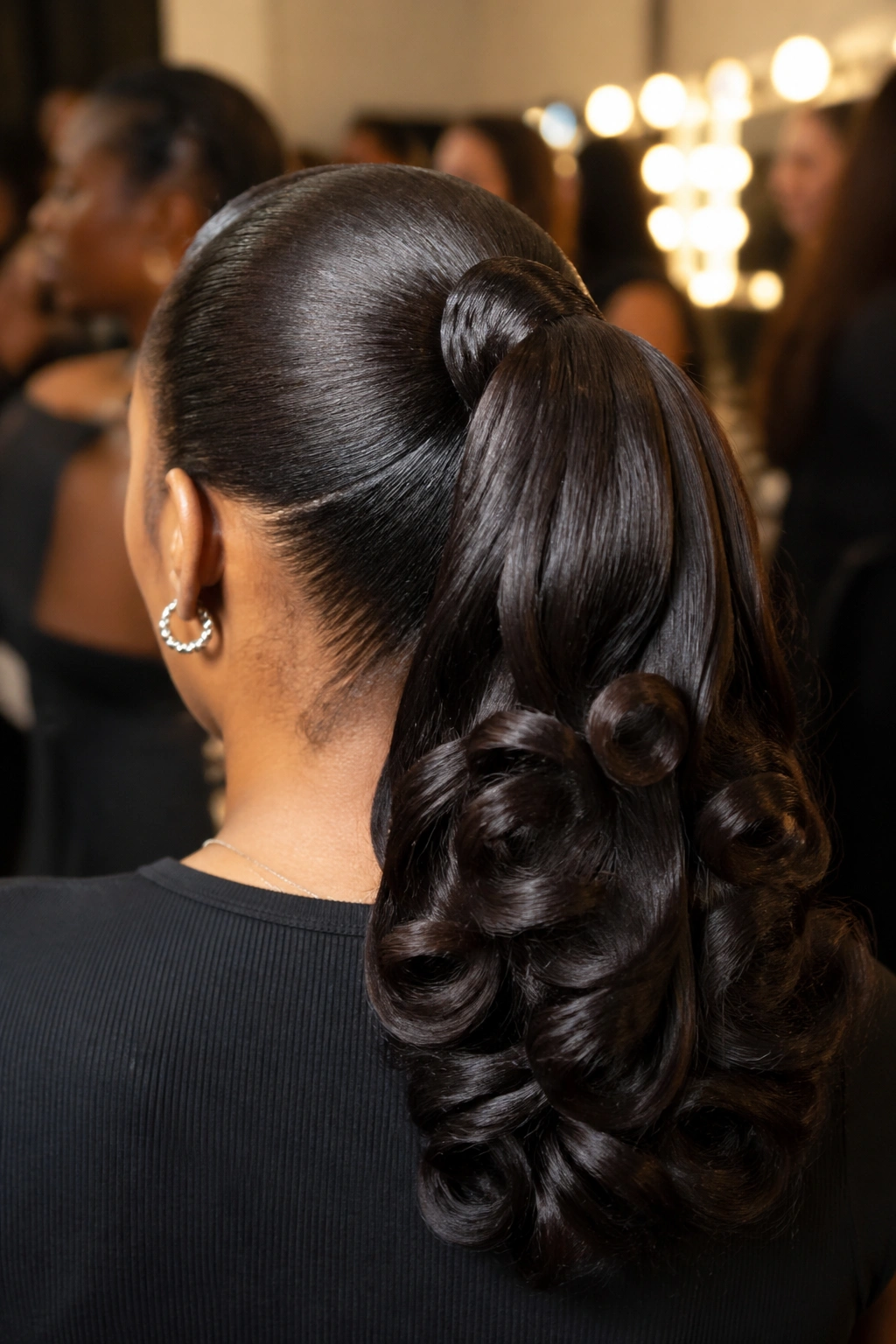 Rear view of a real woman with a pin curl silk press ponytail
