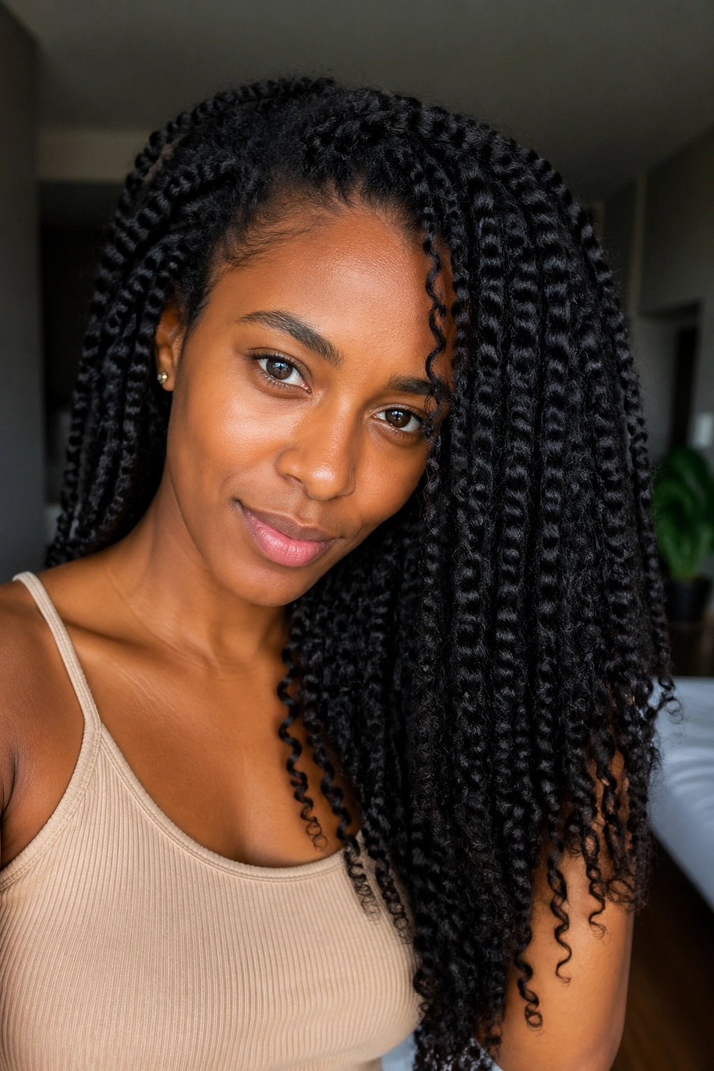 Close-up portrait of a real person showing stretched twist-out hairstyle