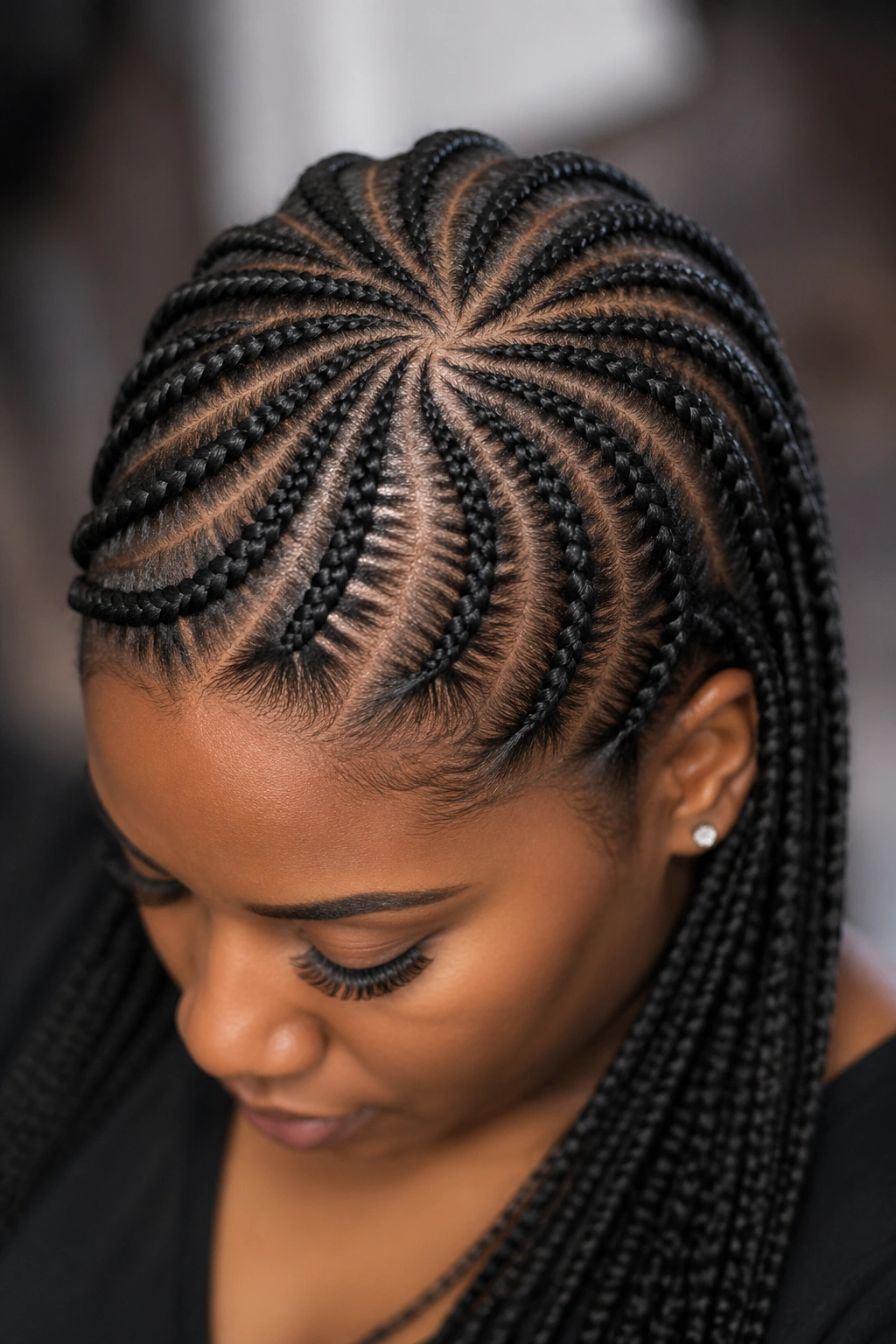 Close-up of a crown swirl braid pattern on a real person's head