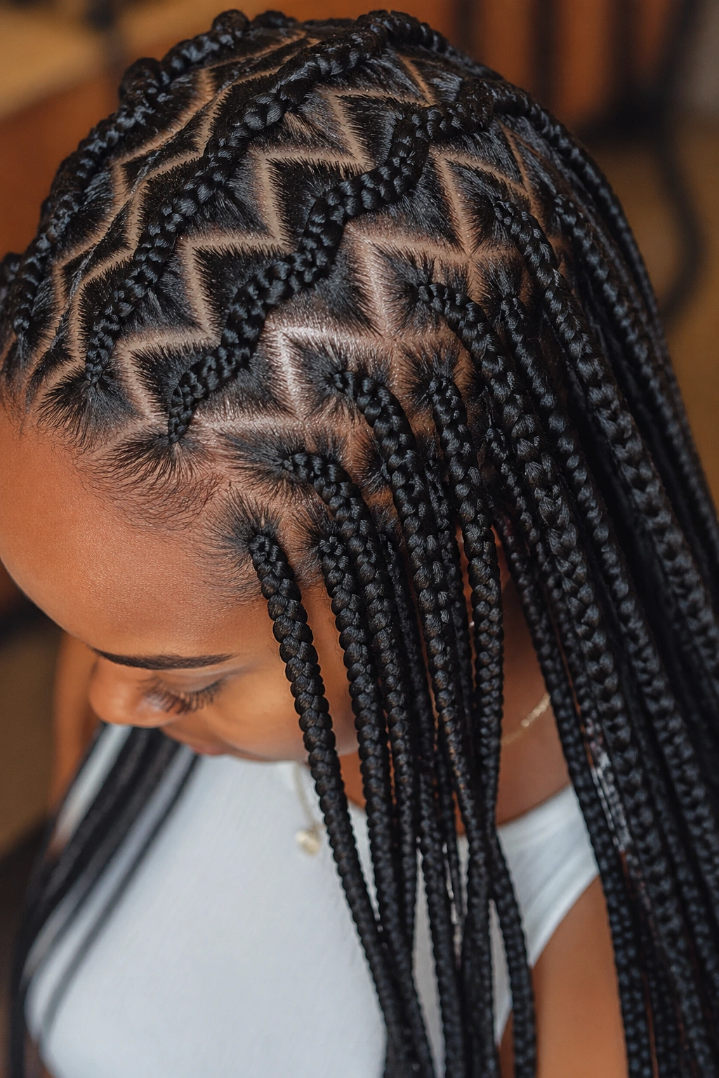 Close-up of zigzag knotless cornrows transitioning to medium box braids